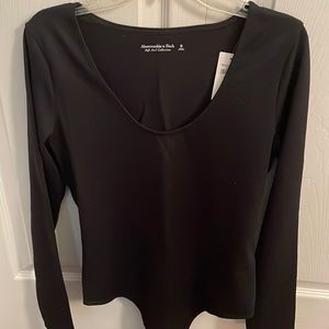 Black long sleeve body suit.